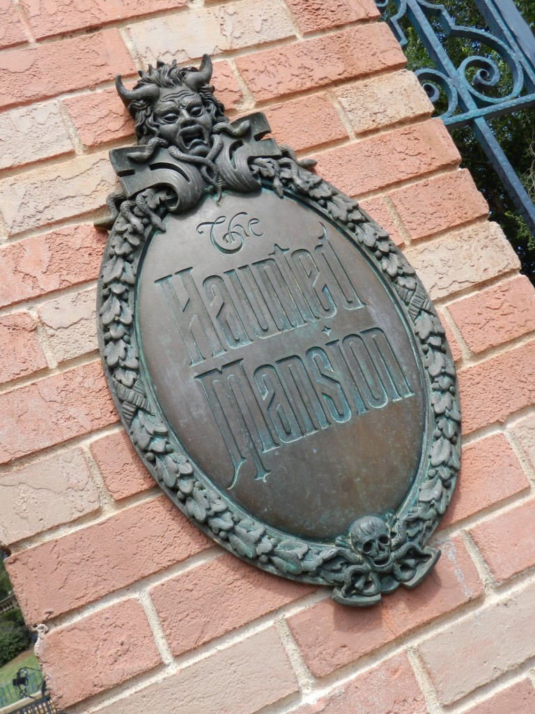 Haunted Mansion at Magic Kingdom with gargoyle statue. Disney Secrets. Keep reading for more Disney Haunted Mansion Merchandise Gift Ideas.