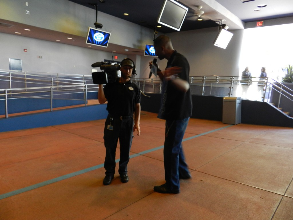 American Idol Experience Disney with Cast Member recording video footage.