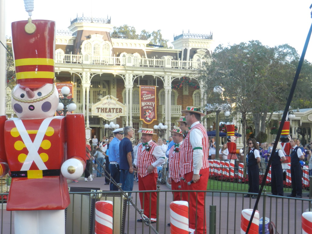 Christmas at Disney World with the Dapper Dans in red and white peppermint outfits. Keep reading to learn about the best things to do at Disney World for Christmas.