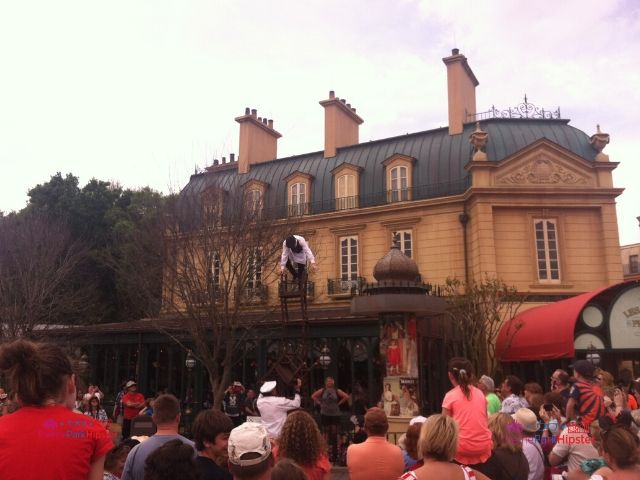 Chefs de France Disney World Epcot Theme Park With Performer on Top Chair in front of Restaurant