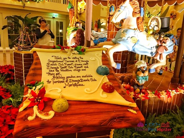 Disney Gingerbread House Carousel at Beach Club Resort with Wendy from Peter Pan horse. Keep reading to learn about the Disney World Gingerbread house display on Theme Park Hipster!