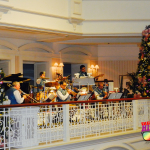 Christmas at Disney's Grand Floridian Resort and Spa with live band playing holiday tunes.
