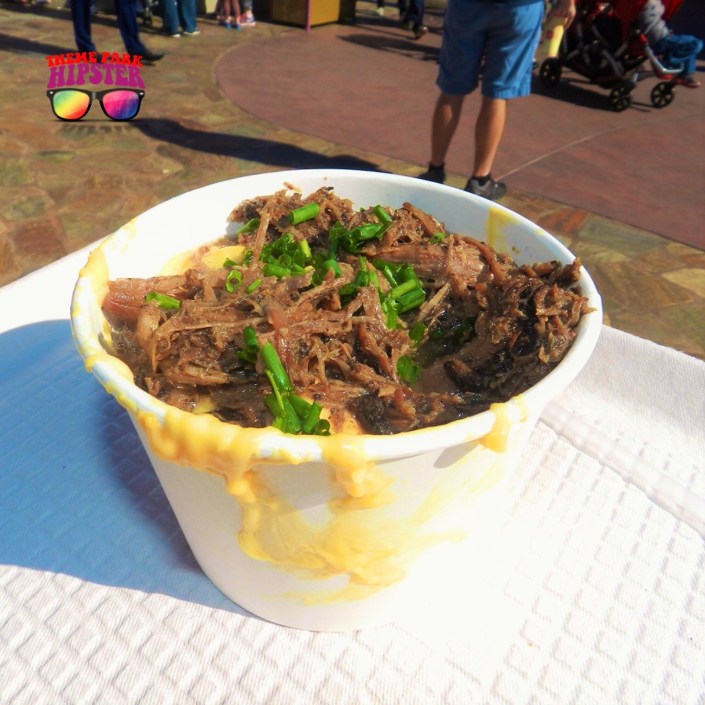 Pot Roast Mac and Cheese at the Friar's Nook in Disney World with juicy brown beef, green scallions on cream macaroni and cheese.