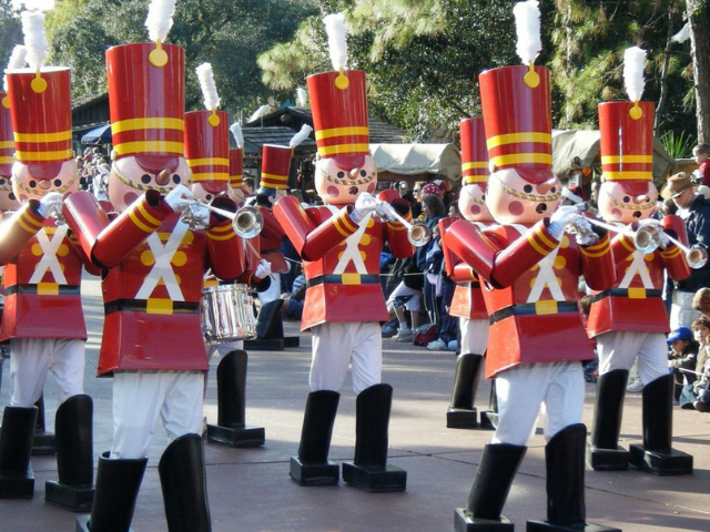 Christmas at Walt Disney World toy soldiers on main street usa disney. Keep reading to get the best things to do at the Magic Kingdom for Christmas and a full guide to 2023 Mickey's Very Merry Christmas Party Tips!