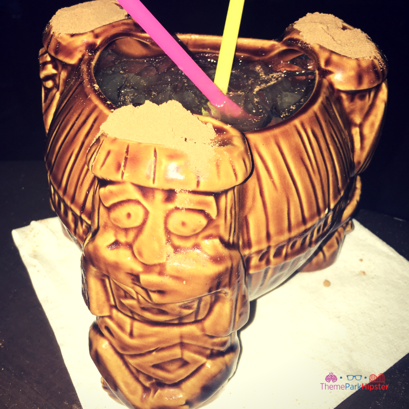 Trader Sam's Disney Tiki Room with volcano cocktail. Keep reading for your own Disneyland Itinerary!