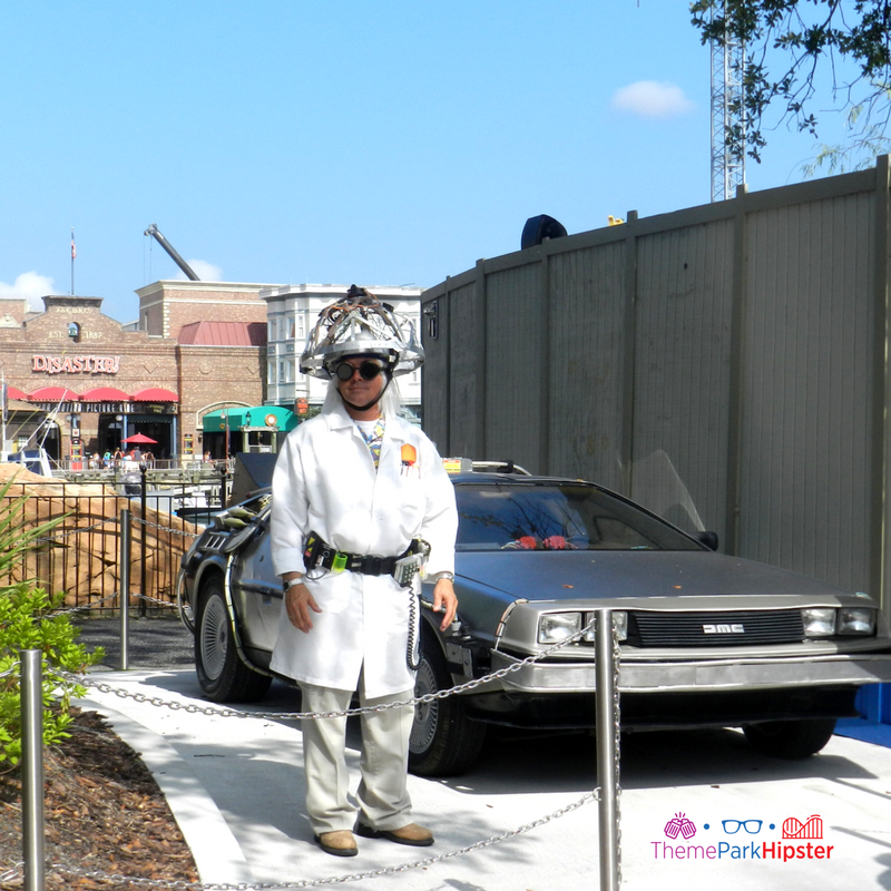 Delorean with Doc Back to the Future Universal Studios Florida with Earthquake Disaster ride in the background. Keep reading to get the best Universal Studios photos.
