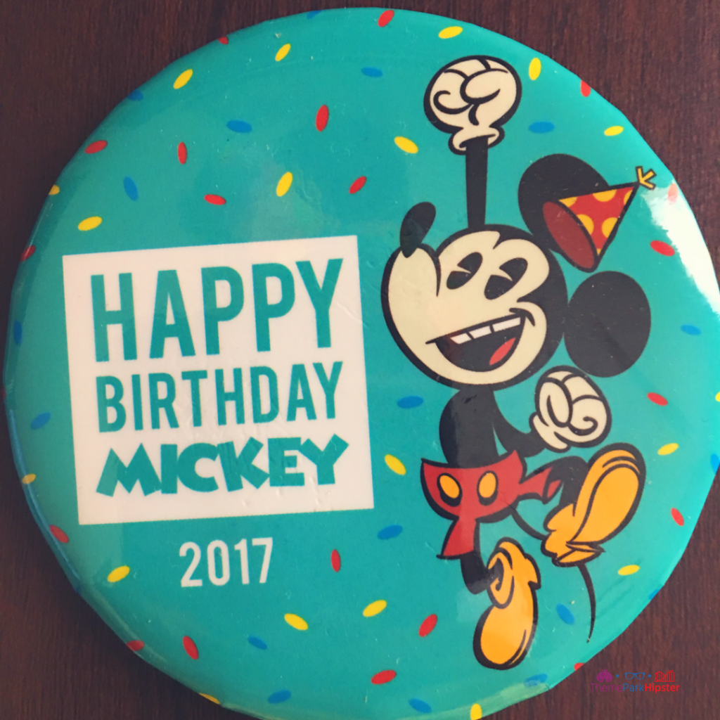 Disney celebration birthday button pin with Mickey Mouse. Free things at Disney. Keep reading to learn about free things to do at Disney World and Disney freebies.