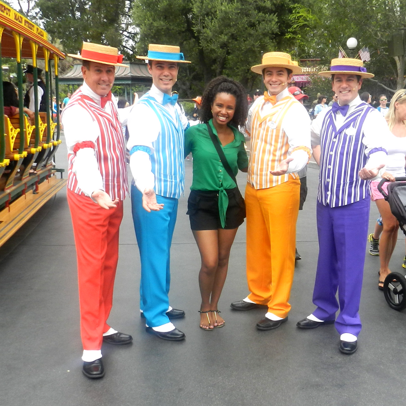 Disney Solo Trip with Dapper Dans in red, blue, yellow and purple along with NikkyJ. Keep reading to know what to pack and what to wear to Disney World in July for your packing list.