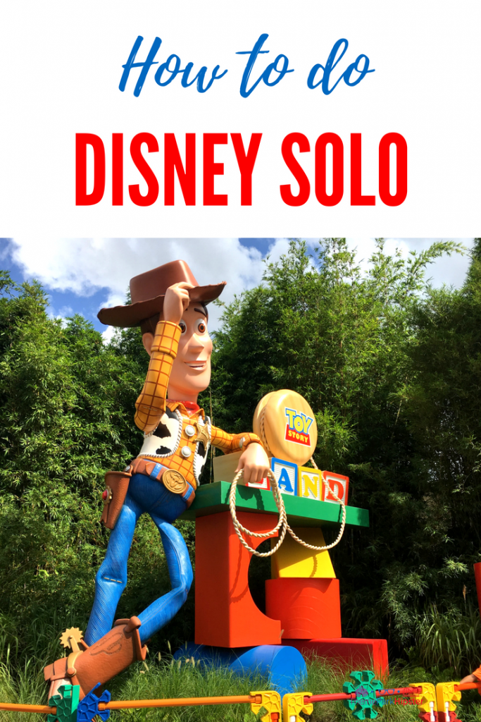 Tips to doing Walt Disney World Solo with Woody of Toy Story Land greeting you.
