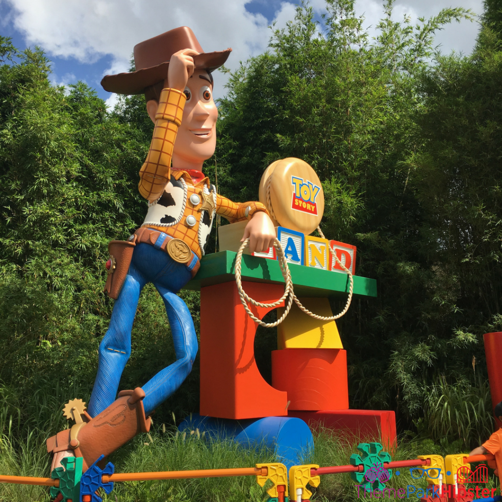 Woody in front of Toy Story Land. How to save money for Disney.