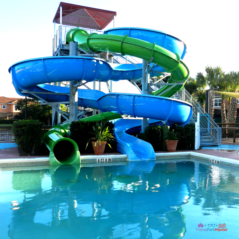 19 reasons you'll love CLC Regal Oaks. Green and blue water slides splashing down into pool.