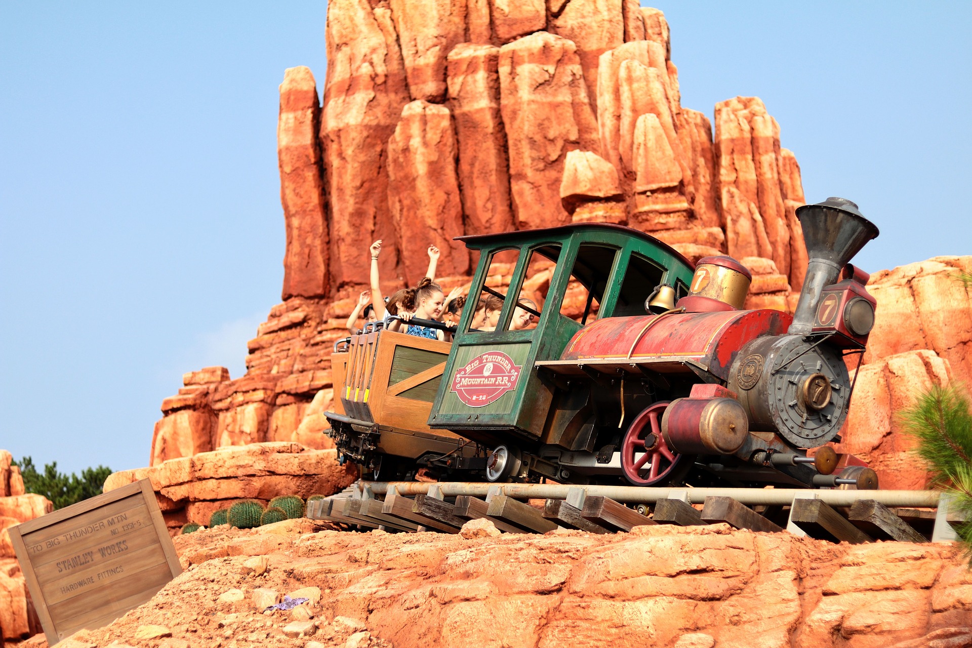 Thunder Mountain Railroad Magic Kingdom Disney Hidden Secrets with golden mountain in the background.