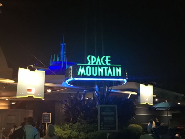 Space Mountain ride entrance at night at the Magic Kingdom
