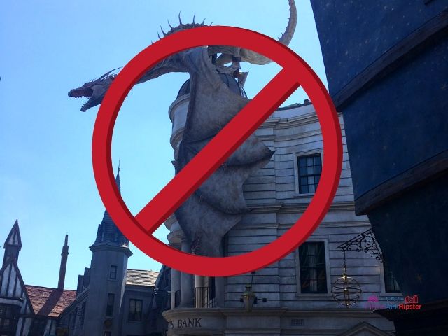 Prohibited items at Universal Orlando signage with fire-breathing dragon. Keep reading if you want to find out more about what to wear to Universal Studios Florida.