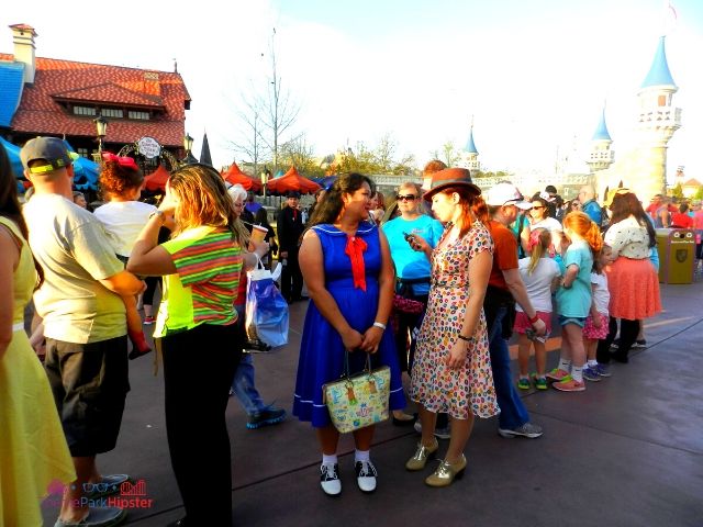 Dapper Day Disney World People in Fantasyland. Keep reading to get the best Dapper Day tips at Disney!