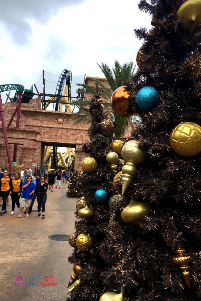 Christmas Town Decoration in Tampa with Christmas Tree near Montu roller coaster. Keep reading to get the full guide on doing Christmas at Busch Gardens Tampa! 