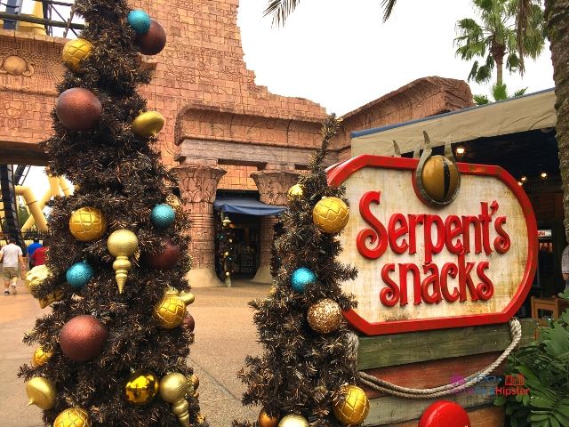 Christmas Town Village at Busch Gardens Tampa Egypt Decor at Serpent's Snacks in front of Montu roller coaster