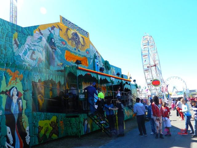 Florida State Fair Blue Haunted House Entrance. Keep reading to get the full Florida State Fair Guide with Tickets, Food, Concerts, Rides and More!
