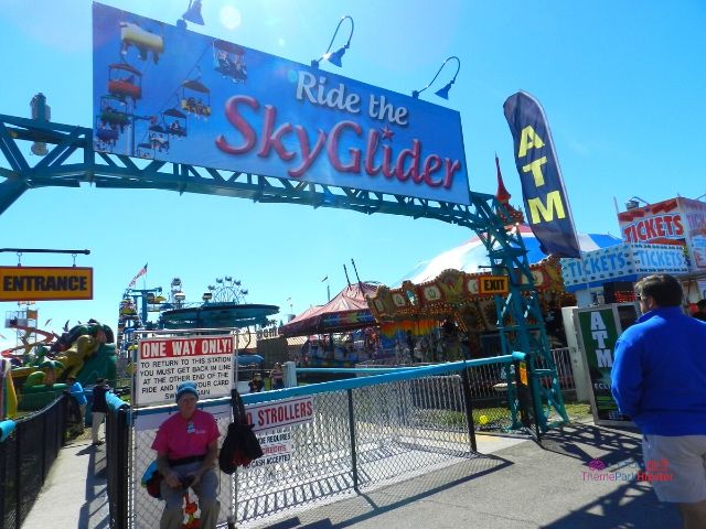 2024 Florida State Fair Ride the Sky Glider Colorful gondolas in the carnival. Keep reading to get the full Florida State Fair Guide with Tickets, Food, Concerts, Rides and More!