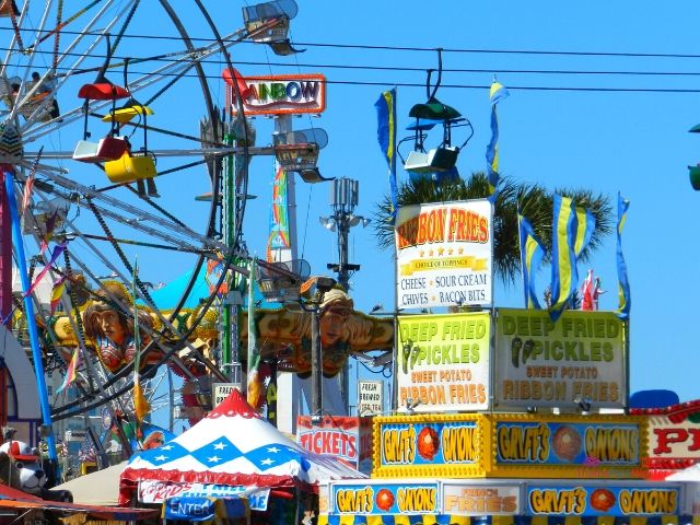 2024 Florida State Fair Rides with Ferris Wheel and Food Kiosks. Keep reading to get the full Florida State Fair Guide with Tickets, Food, Concerts, Rides and More!
