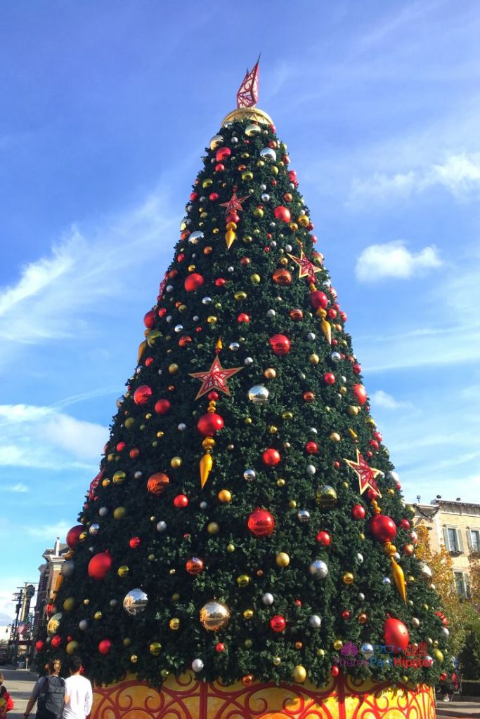 Majestic Christmas Tree at Universal Studios Orlando Florida in Central Park. Keep reading to learn about the Universal Express Pass Fast Passes.