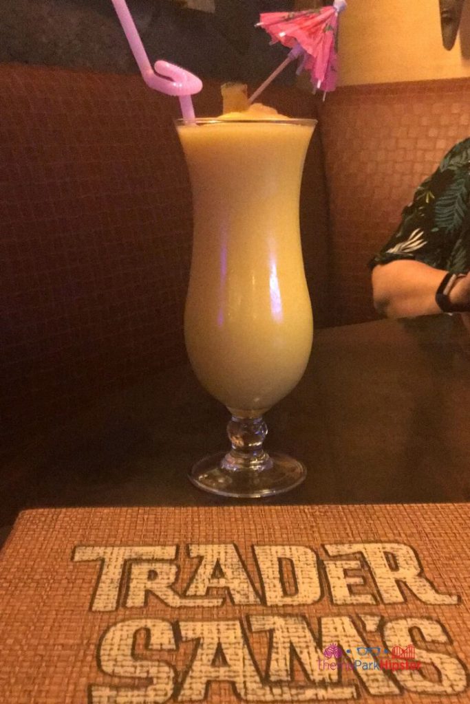 Trader Sam’s Grog Grotto Barbancourt Pango Rhum with umbrella accessory in it. Keep reading to learn where to find the best dole whip at Disney World.
