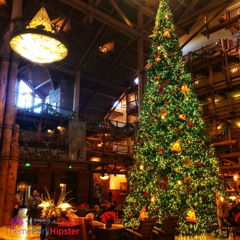 Disney Wilderness Lodge Christmas Tree. Keep reading to get the best Disney Christmas pictures and to know where to take the best Christmas photos at Disney World!