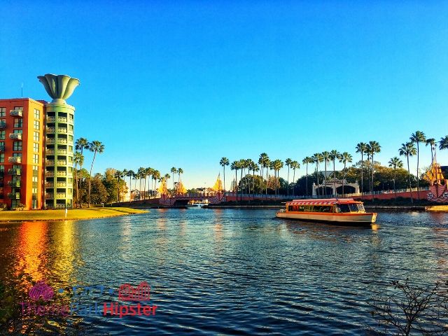 Dolphin Hotel Resort with Disney Boat on Lagoon. Keep reading to learn about free things to do at Disney World and Disney freebies.
