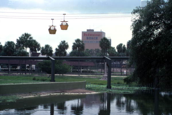 View showing gondola skyride at the Busch Gardens amusement park in Tampa Florida next to Anheuser-Busch Brewery