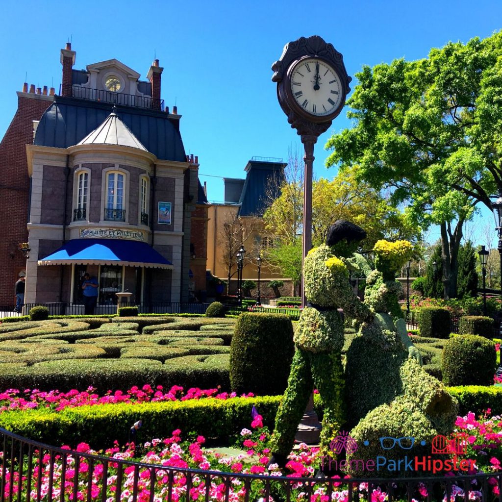 Epcot Flower and Garden Festival Cinderella and Prince Charming Topiary in France Pavilion. How to Find Cheap Flights to Disney World