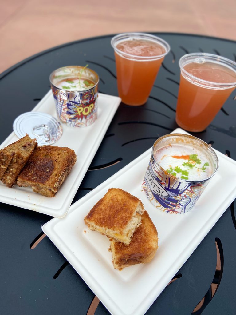 Tomato Soup and Grilled Cheese with Glitter Beer at Epcot Festival of the Arts. Keep reading to get the full Epcot Festival of the Arts guide, tips, food, concerts and more!