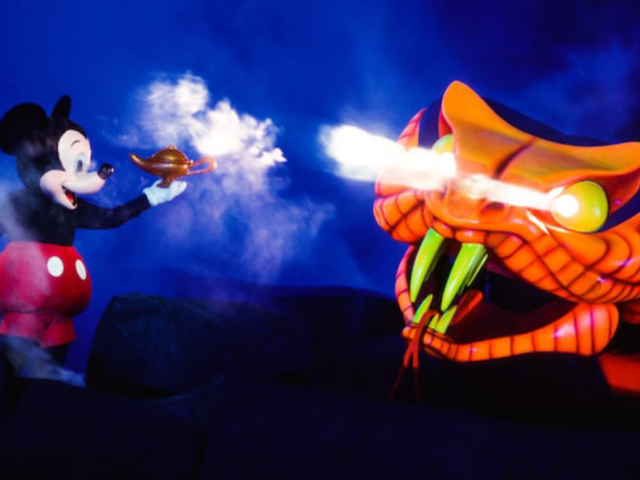 Fantasmic at Disney with Mickey Mouse Facing Orange Snake.
