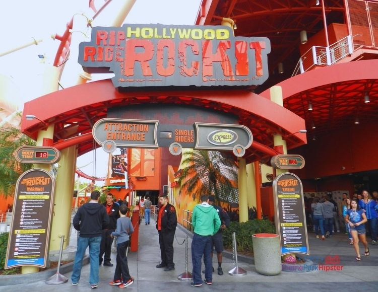 Hollywood Rip Ride Rockit at Universal Studios entrance where theme park guests are wearing lightweight sweaters and jackets. Keep reading to find out more about what to pack for Universal Studios Florida.