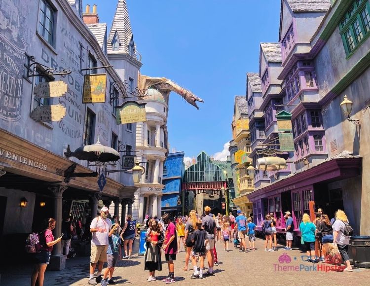 Diagon Alley with Dragon on Top of Gringotts. Keep reading to learn about Universal Orlando height requirement.