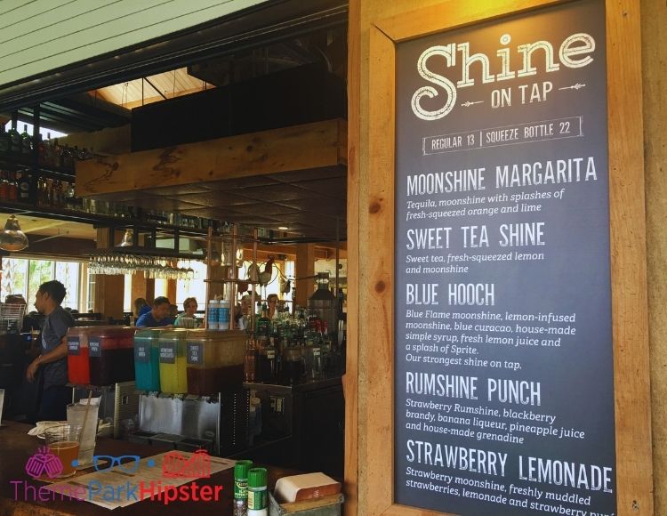 Homecomin Disney Springs Moonshine Bar. Keep reading to get the best drinks at Disney Springs and the best adult beverages at Walt Disney World!