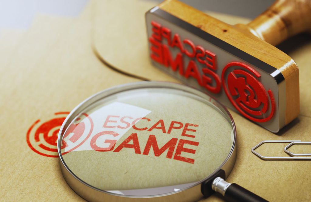 Escape Games in Orlando with a magnifying glass and giant wooden stamp that says Escape Game. Keep reading to find out more about where to go for the best escape room in Orlando. 