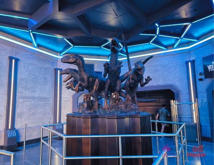 Universal Velocicoaster statue in queue line at Islands of Adventure. Keep reading to get the best Jurassic World Velocicoaster photos.