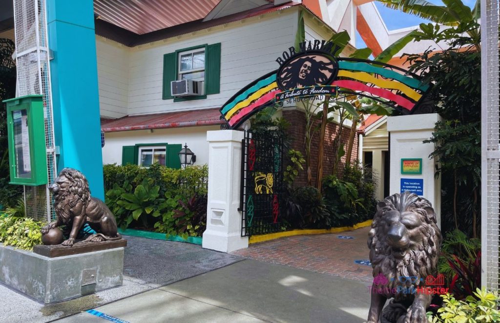 Entrance of Bob Marley Restaurant at CityWalk, showing two Lion of Judah statues framing the green, yellow, and red archway that reads "a tribute to freedom." Keep reading to to find out more Mistakes to Avoid at Universal Orlano Resort!
