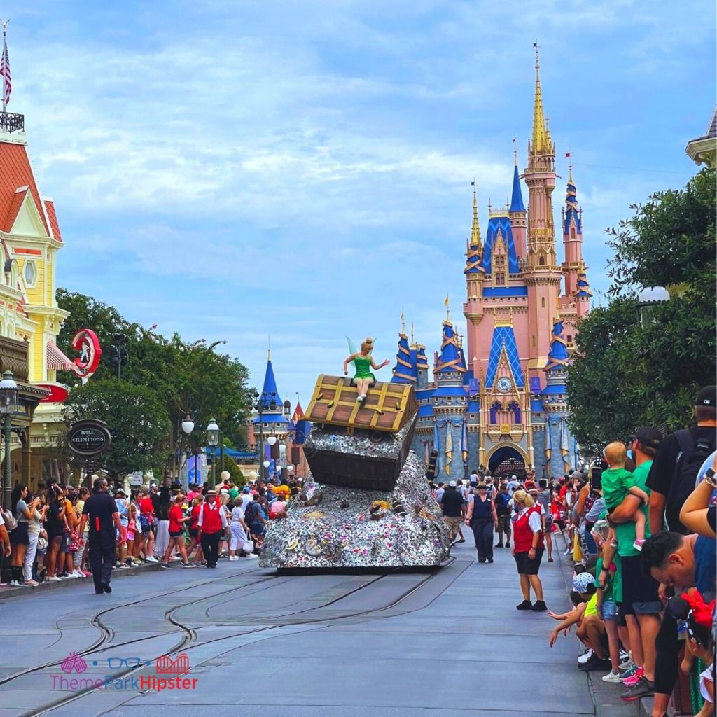 Cavalcade at Disney Magic Kingdom with Tinker Bell. Keep reading to learn how to fly to Orlando and how to find cheap flights to Orlando.