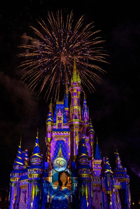 Disney Enchantment Fireworks Magic Kingdom Night Show 50th Anniversary with Mulan on Cinderella Castle. Keep reading to learn about the best Magic Kingdom shows and why you'll want to stick around to watch a Magic Kingdom night show.