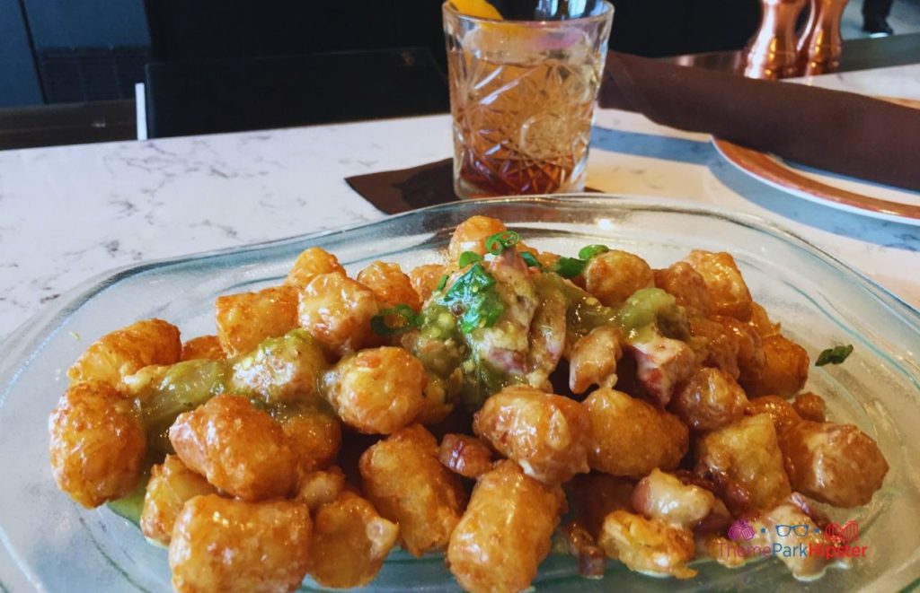 Toothsome Chocolate Emporium Loaded Tots. Keep reading to get the full Guide to Universal CityWalk Orlando with photos, restaurants, parking and more!