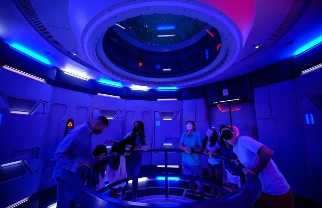Visitors of Space 220 Restaurant, admiring the decor in what is known as the “height of dining” at EPCOT Walt Disney World Resort. Photographer Todd Anderson. Keep reading to learn more about the best things to do at Disney World for solo travelers.