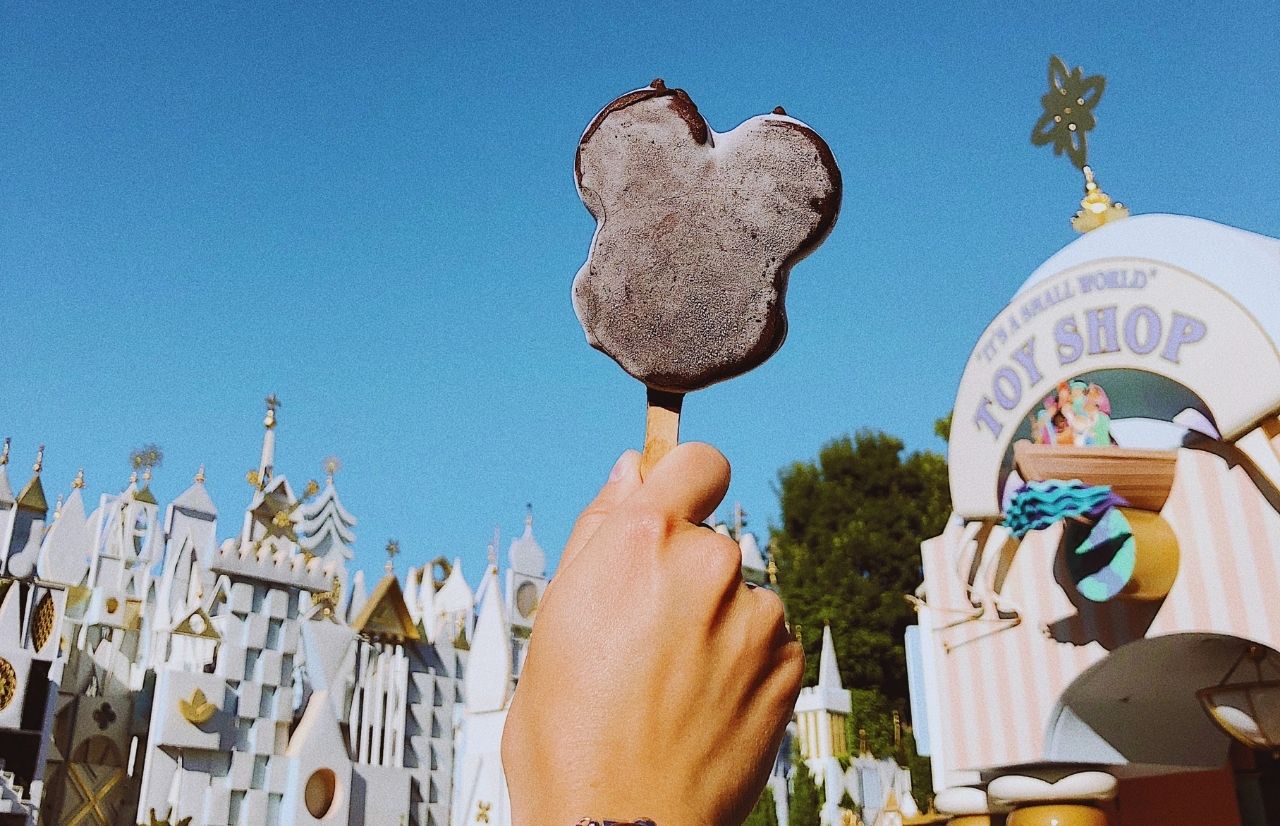 Mickey Mouse Ear Ice Cream Bar in Front of Small World Disneyland