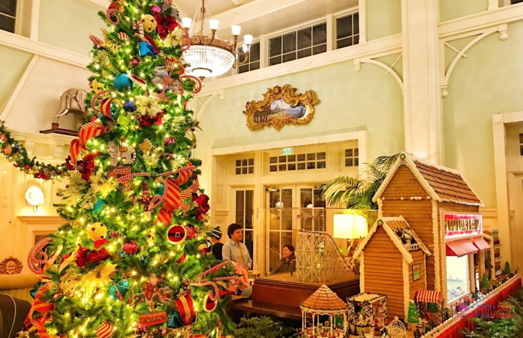 Boardwalk Inn Gingerbread House and Christmas Tree. Keep reading to learn about the Disney World Gingerbread house display on Theme Park Hipster!