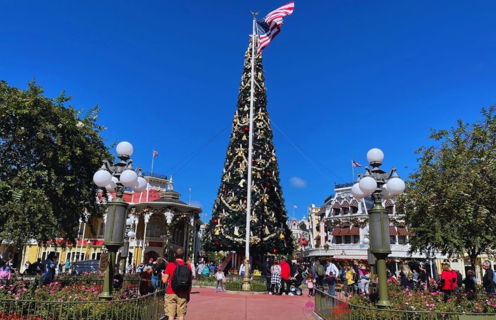 Christmas Tree in Main Street USA Magic Kingdom. Keep reading to get your perfect Disney Resort Christmas Decorations Tour!