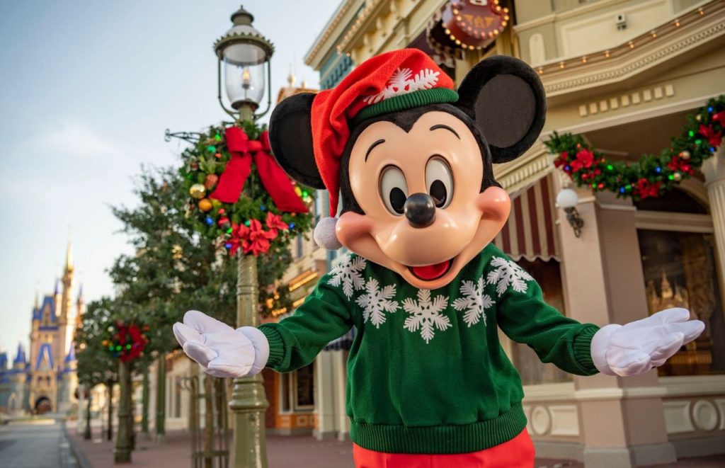 Mickey Mouse on Main Street USA for Christmas at Disney Magic Kingdom. Keep reading to get the best Disney Christmas movies and films!
