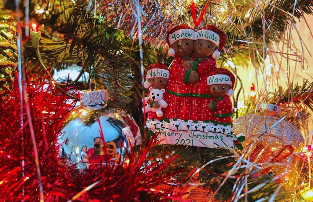 SeaWorld Christmas Celebration Black Family Holiday Ornament with red pajamas. Keep reading to learn about Christmas at SeaWorld Orlando!