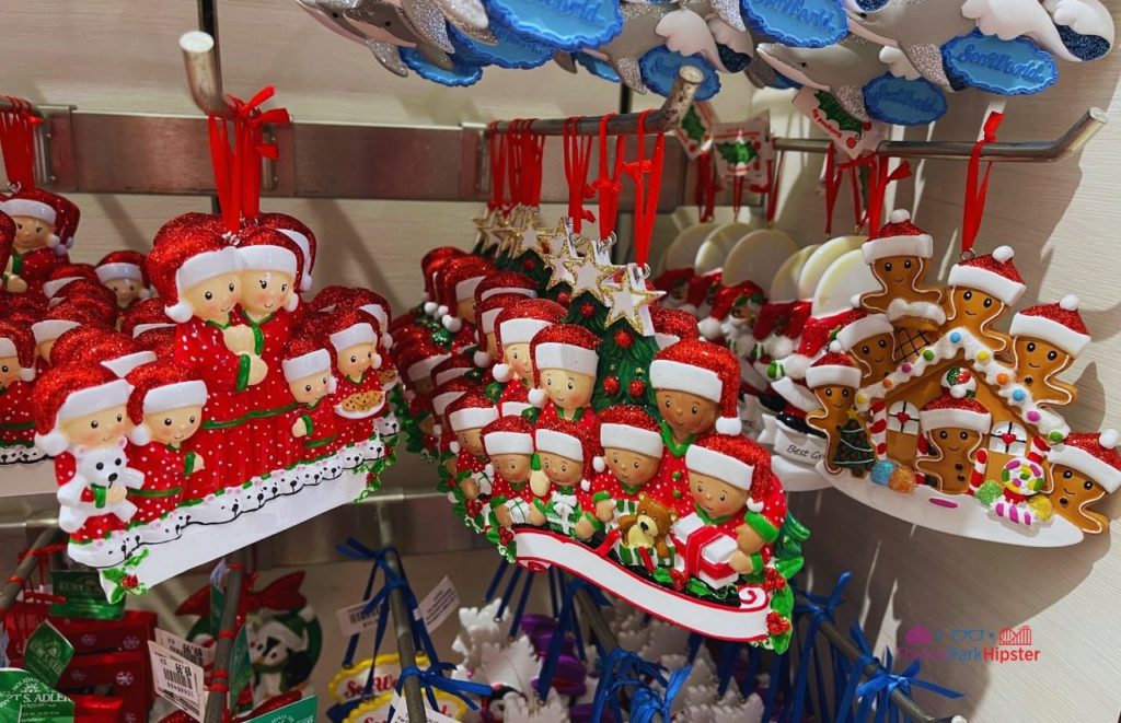 SeaWorld Christmas Celebration Holiday Ornaments with Families in red Christmas Pajamas. Keep reading to learn about Christmas at SeaWorld Orlando!
