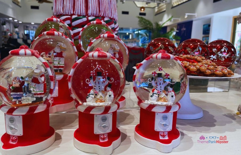 2023 SeaWorld Christmas Celebration Holiday Store with Snowman in snow globe. Keep reading to learn about Christmas at SeaWorld Orlando!