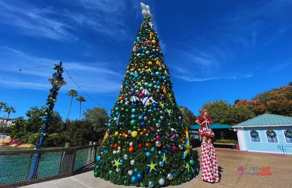 SeaWorld Christmas Celebration with Gingerbread Peppermint Lady in Front. Keep reading to learn how to have a Solo Trip to SeaWorld and how to travel alone with anxiety.